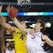Michigan freshman Mitch McGary fights for the ball around Kansas senior Jeff Withey during the first half at Cowboys Stadium in Arlington, Texas on March 29, 2013. Melanie Maxwell I AnnArbor.com